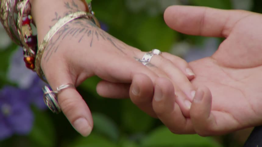 A clip of couple holding hands