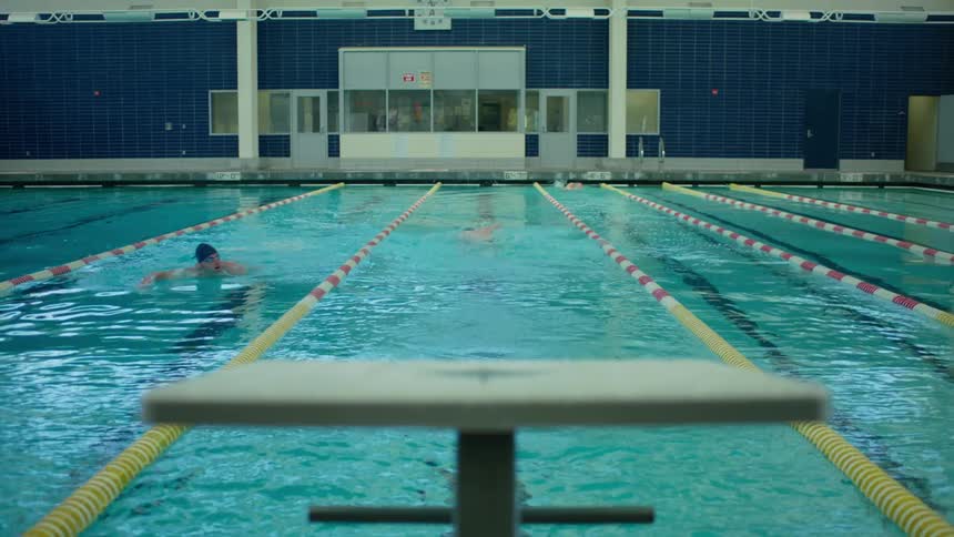 A swimmer dives into the water