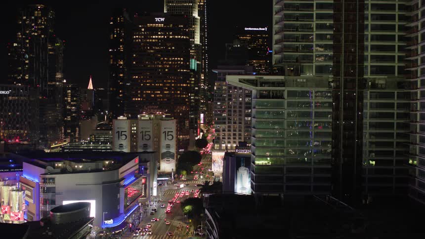 Traffic and people move around on a major city artery