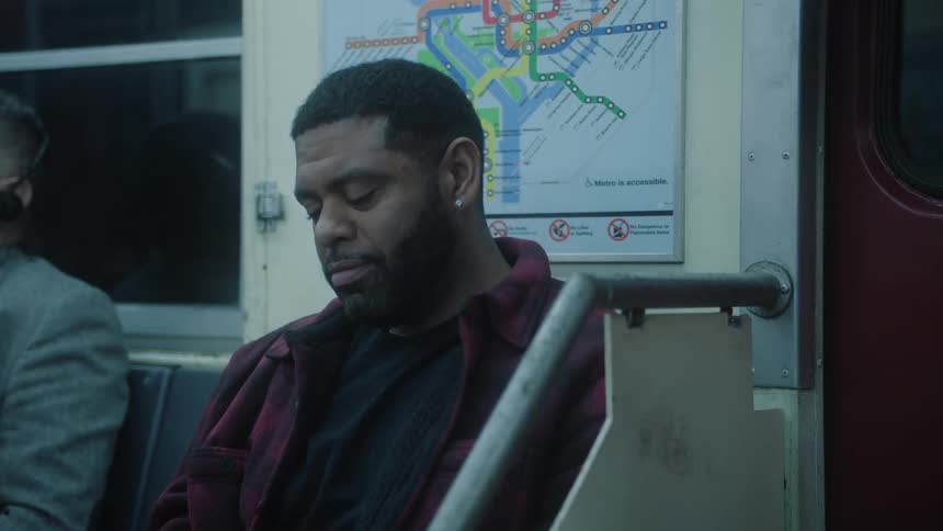 A man is sleeping on the train