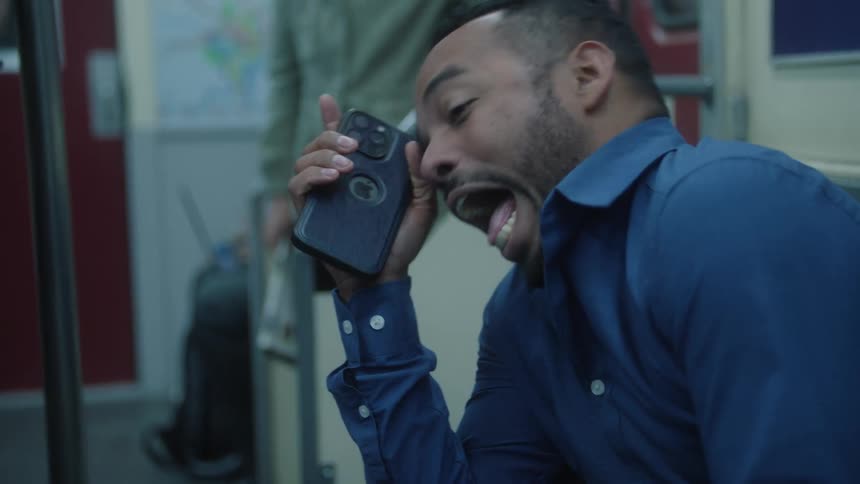 Mens inside a train laughing