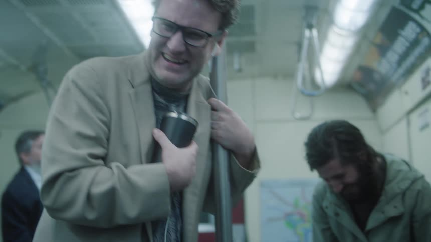 Mens inside a train laughing