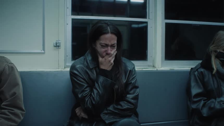 While taking the subway a woman cries