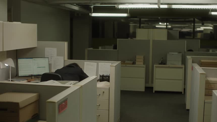 Bright office room with desks with computers and dividers