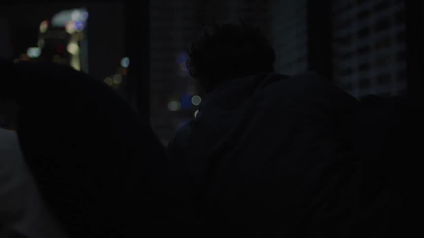 A man getting up in bed at night
