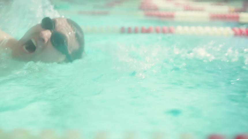 Man swimming in a deep shot lane in the pool
