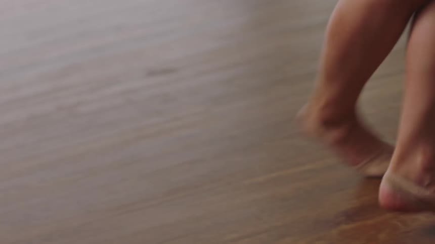 A dancer practicing in an empty room