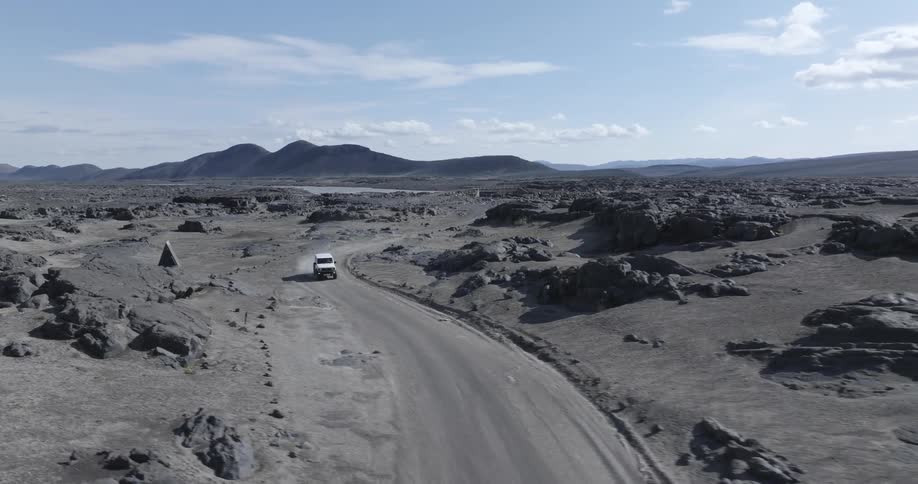 An atv driving on a desert road