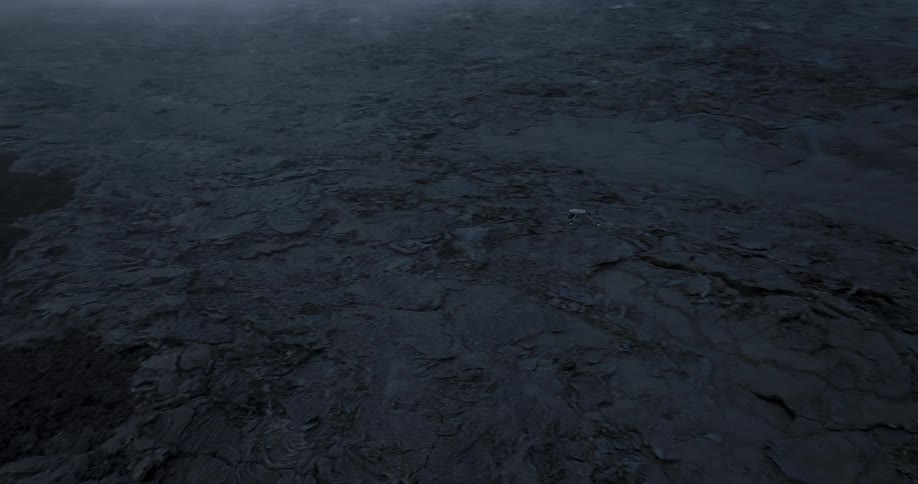 A drone flies past the cliff