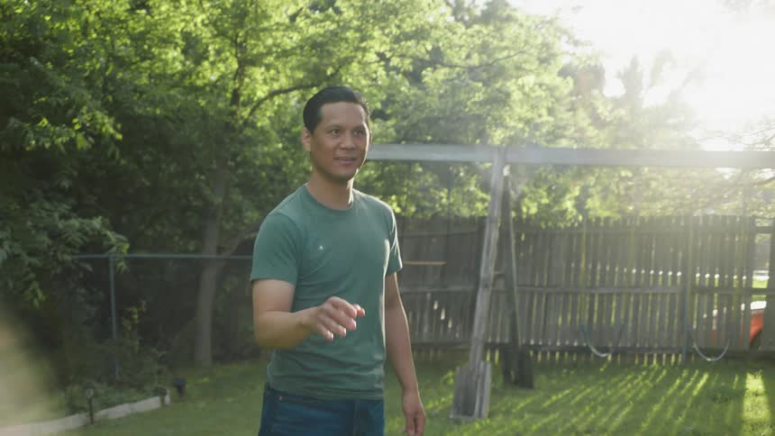 A man catches a small model plane