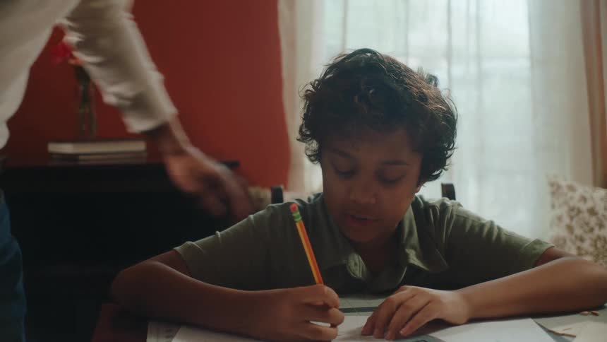 Father helping his son with homework