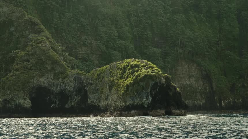 Rocky coast landscape with calm sea around