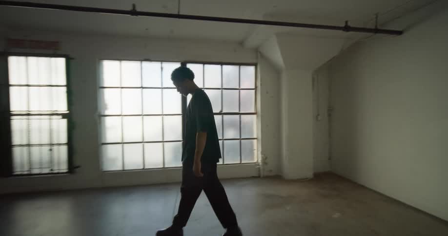 A man walks through the empty studio