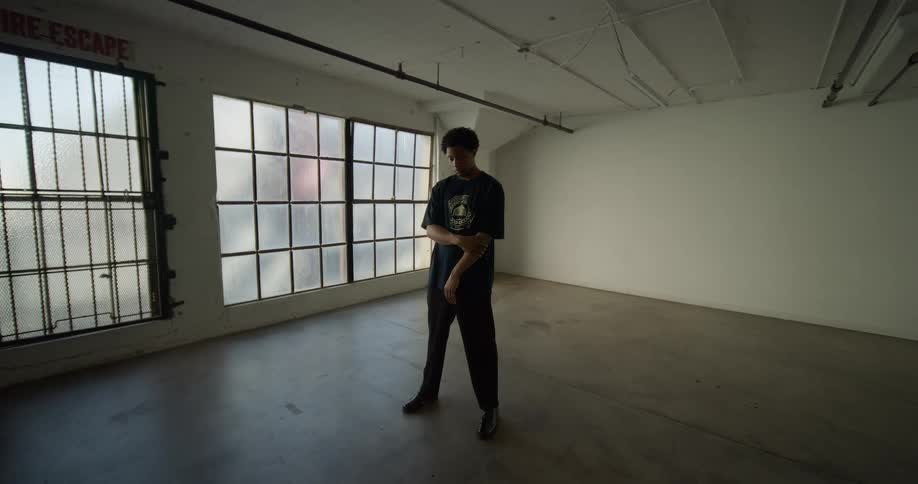 Man standing in an empty indoor room