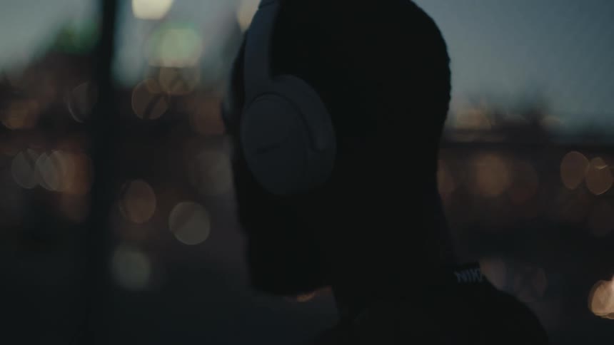 A man is listening to his headphones