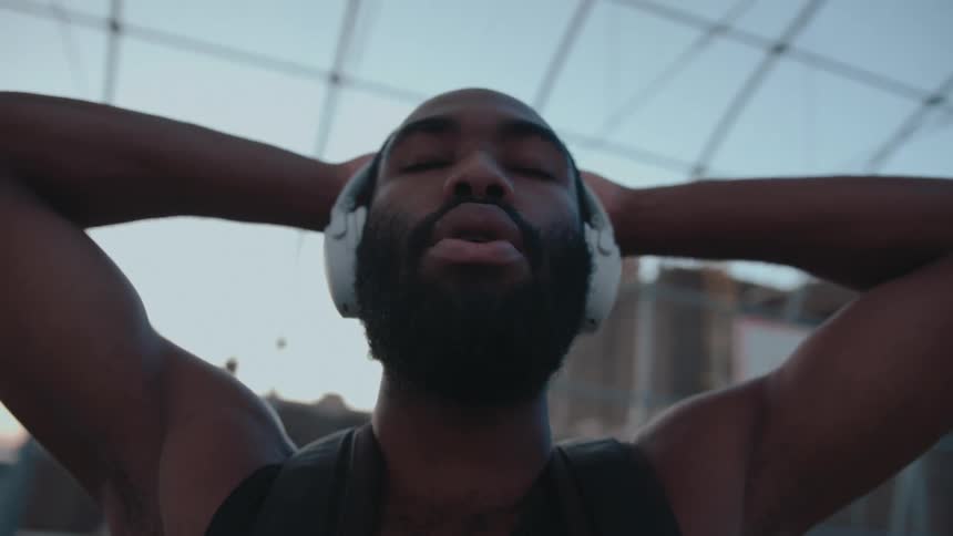 A black man breathes on a basketball court