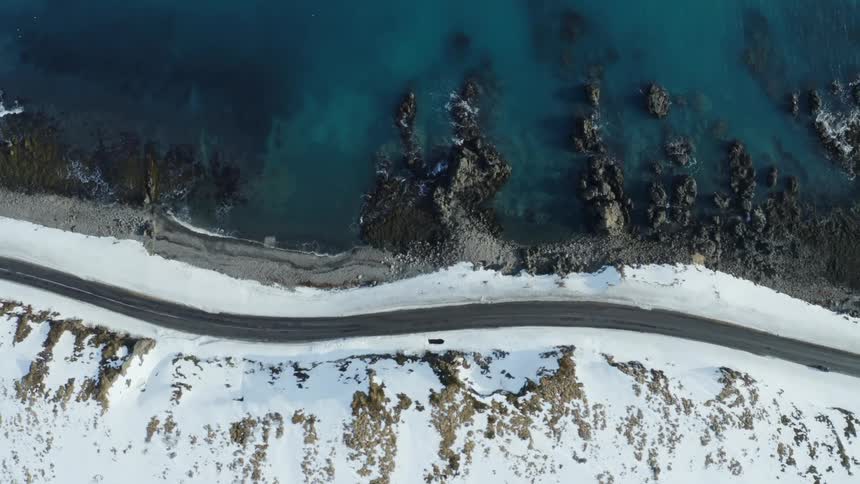 An empty road is on the shore