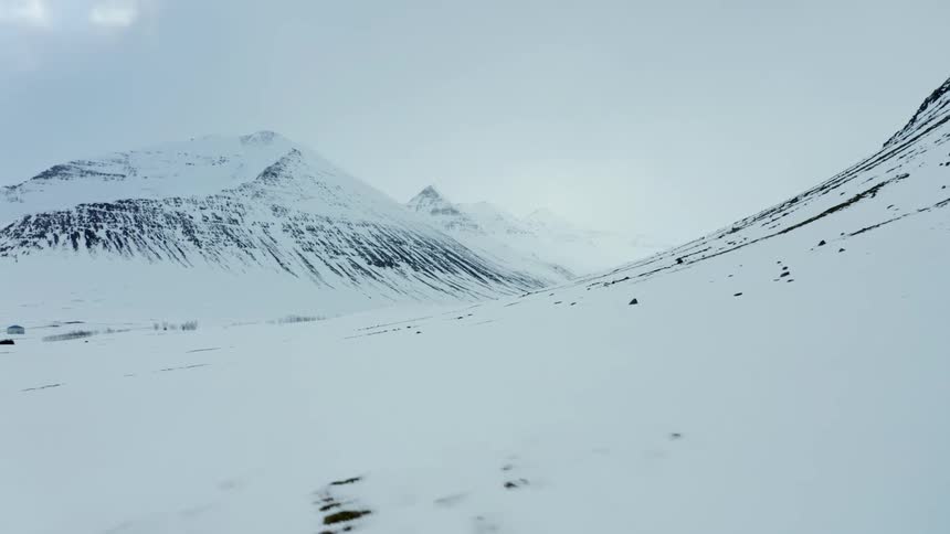 A snow covered arctic mountain range