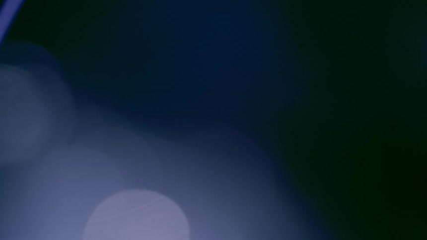 Abstract lights flashing on a black background