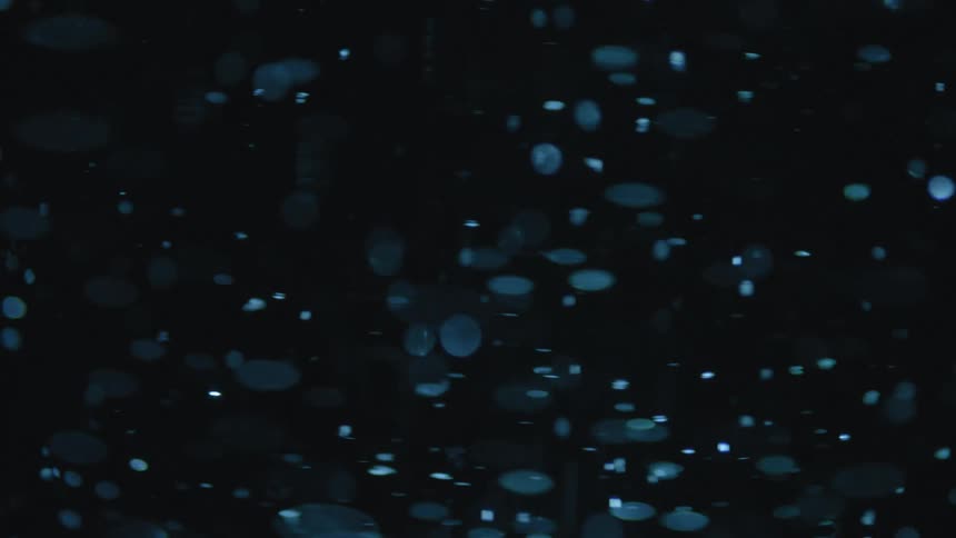 Particles move around in dark fluid