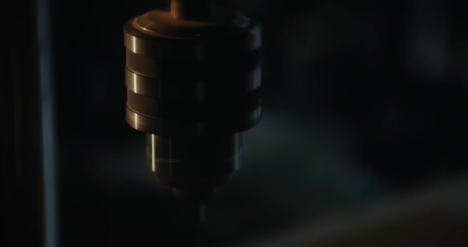 Closeup on a drilling machine with a persons hand stirring