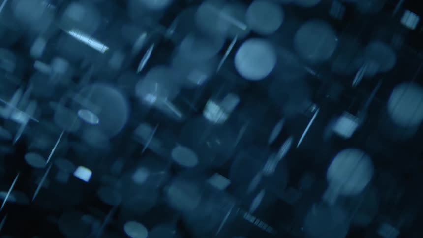 Water with bright abstract particles rotating