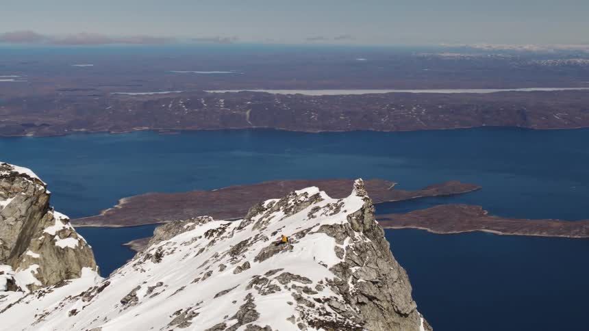 Aerial view of a mountain range and landscape with lakes visible