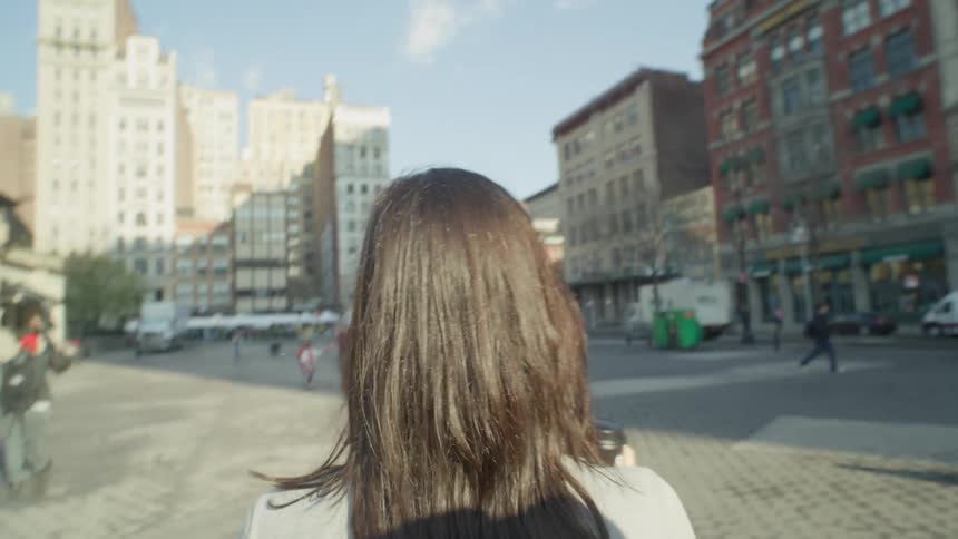 Pedestrians walk through the city