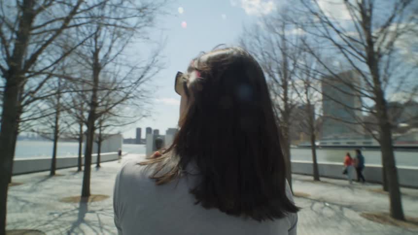 Tourists walk by the shore in the city
