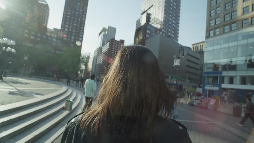 Pedestrians walk through the large city