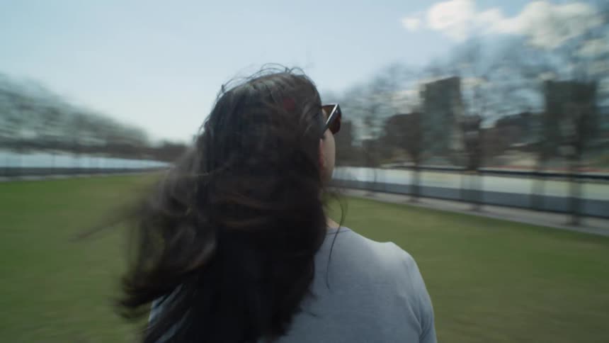 A tourists is walking around the park in the city