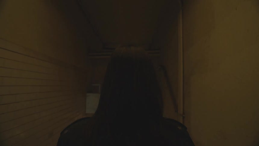 A woman enters the subway station