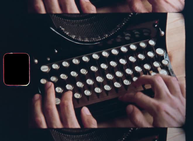 Dynamic handheld 8mm film closeup of a middle-aged male person sitting at a wooden table or desk in the office concentrating on typing on a vintage typewriter as his hands press down the mechanical keys of the analog machine