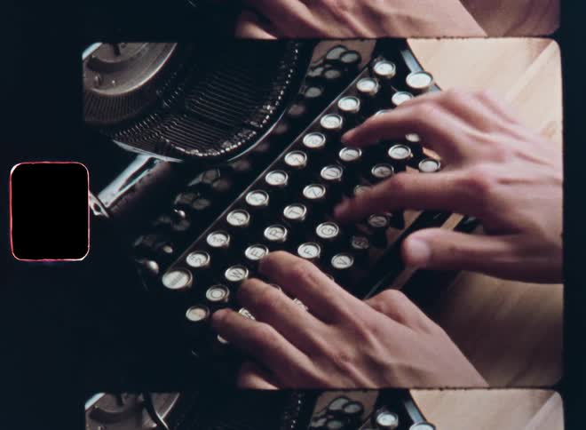 Super-8 closeup of the hands of a person sitting at a wooden desk who uses an old vintage typewriter to type or write a letter or mail while the mechanical parts of the retro text machine move with precision