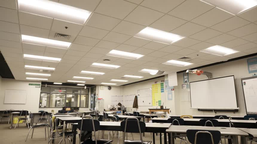 A school room with illuminated chairs and tables