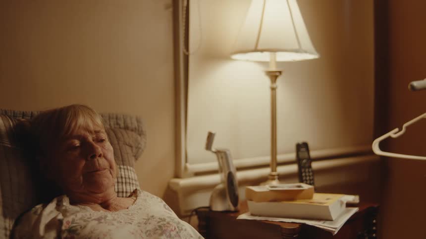 A woman is resting in bed