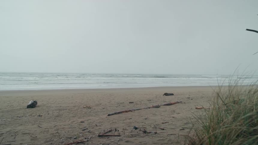 Equipment and debris on a beach in the daylight