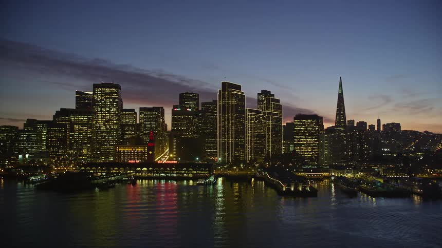 Aerial view of the san francisco port and city skyline at dusk