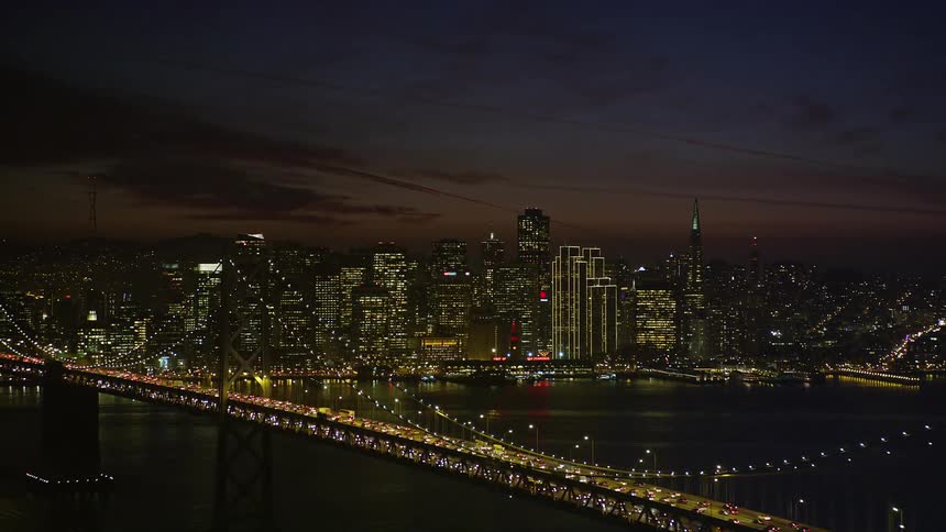 Massive traffic across a bridge near a coastal city