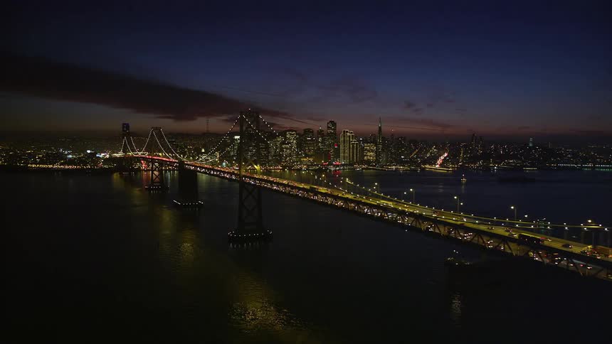 Aerial view of the oakland bay bridge with the san francisco skyline in the background