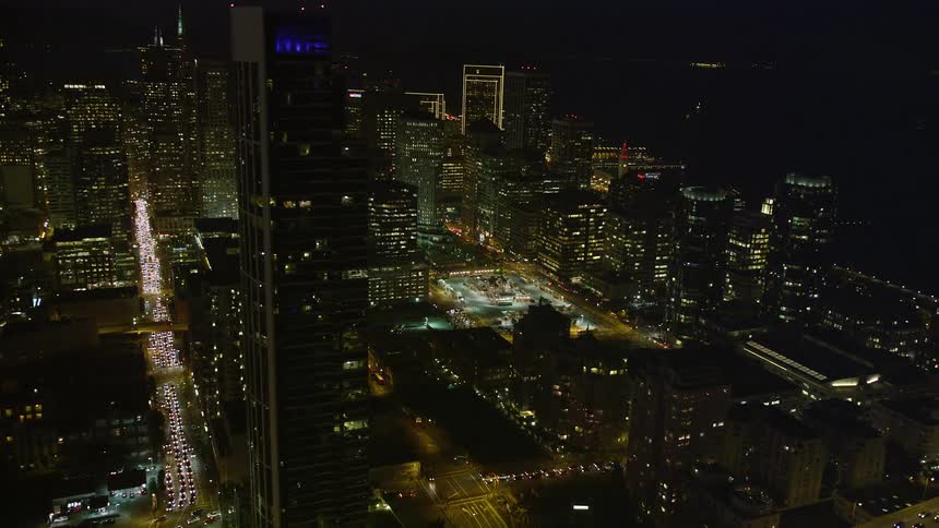 A large city at night with many buildings and traffic