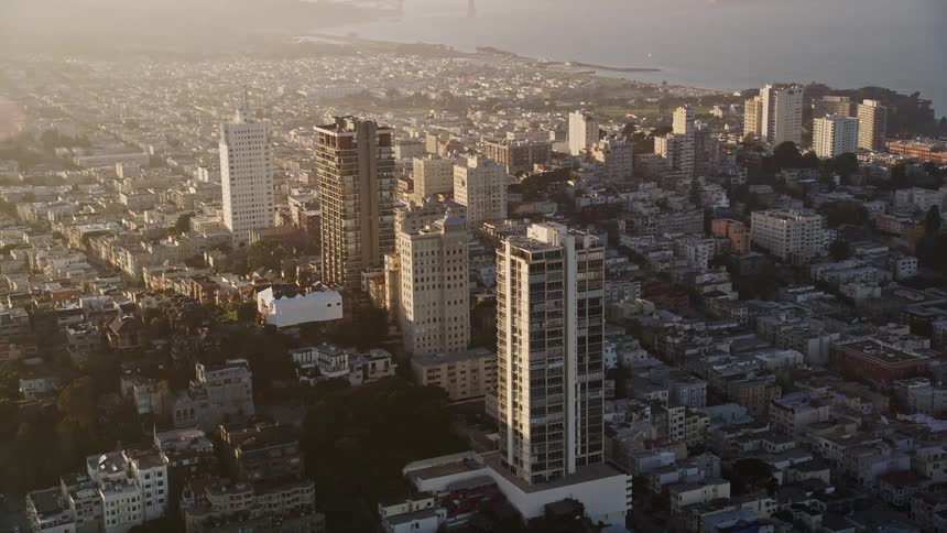 The downtown san francisco cityscape in the morning hours with the waterfront visible in the distance