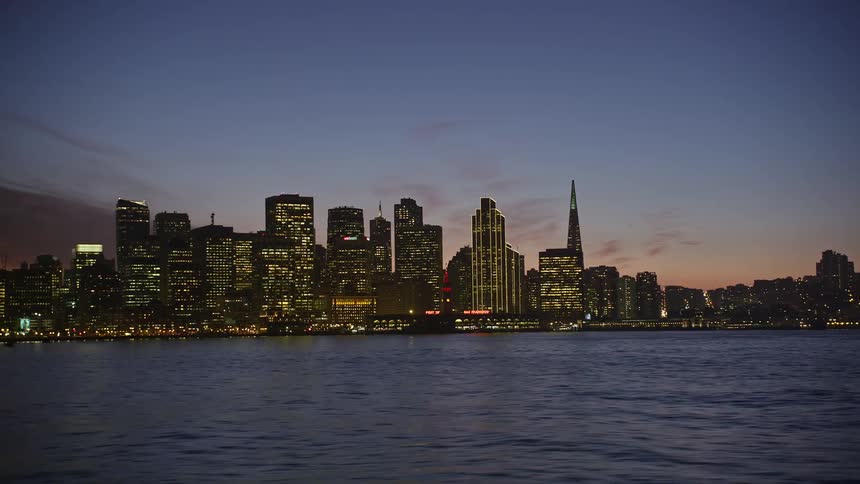 Waterfront city skyline of metropolitan area at dusk
