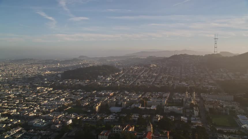 A mid day aerial clip of an urban city