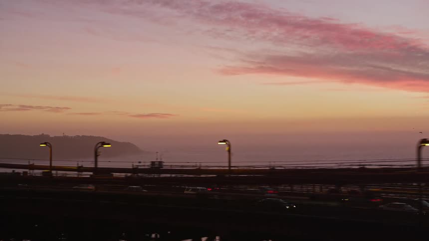 Traffic moves across a bridge over a bay