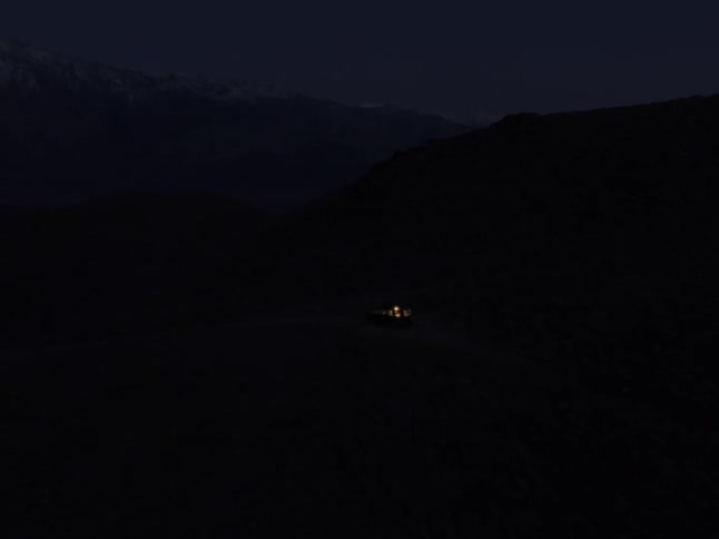A small spotlight on a night in a mountainous region