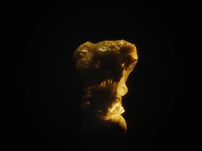 An abstract object is in the dark and then appears and starts to shine