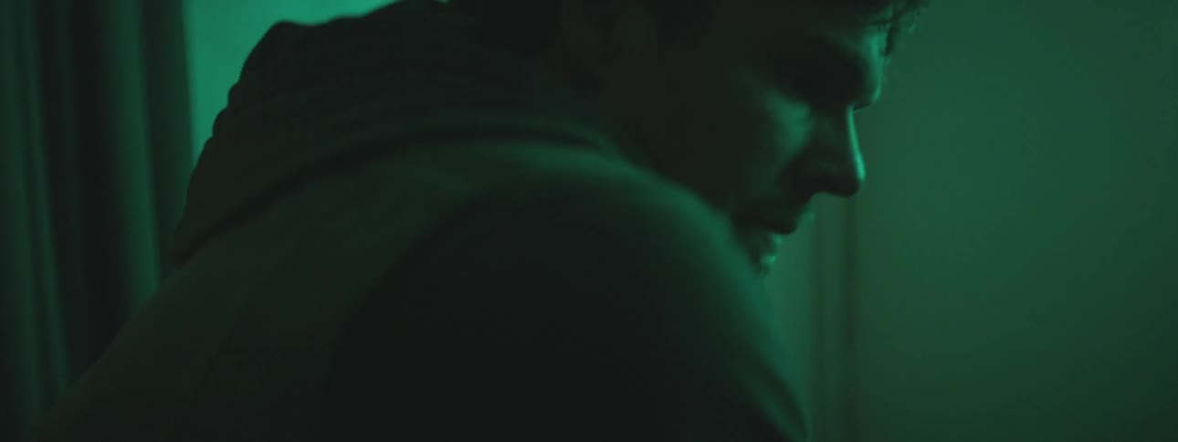 Man standing up while in low light