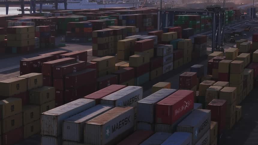 Aerial view of containers organized in a seaside port on a morning