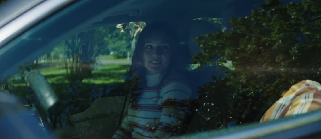 Man and woman inside car closing doors